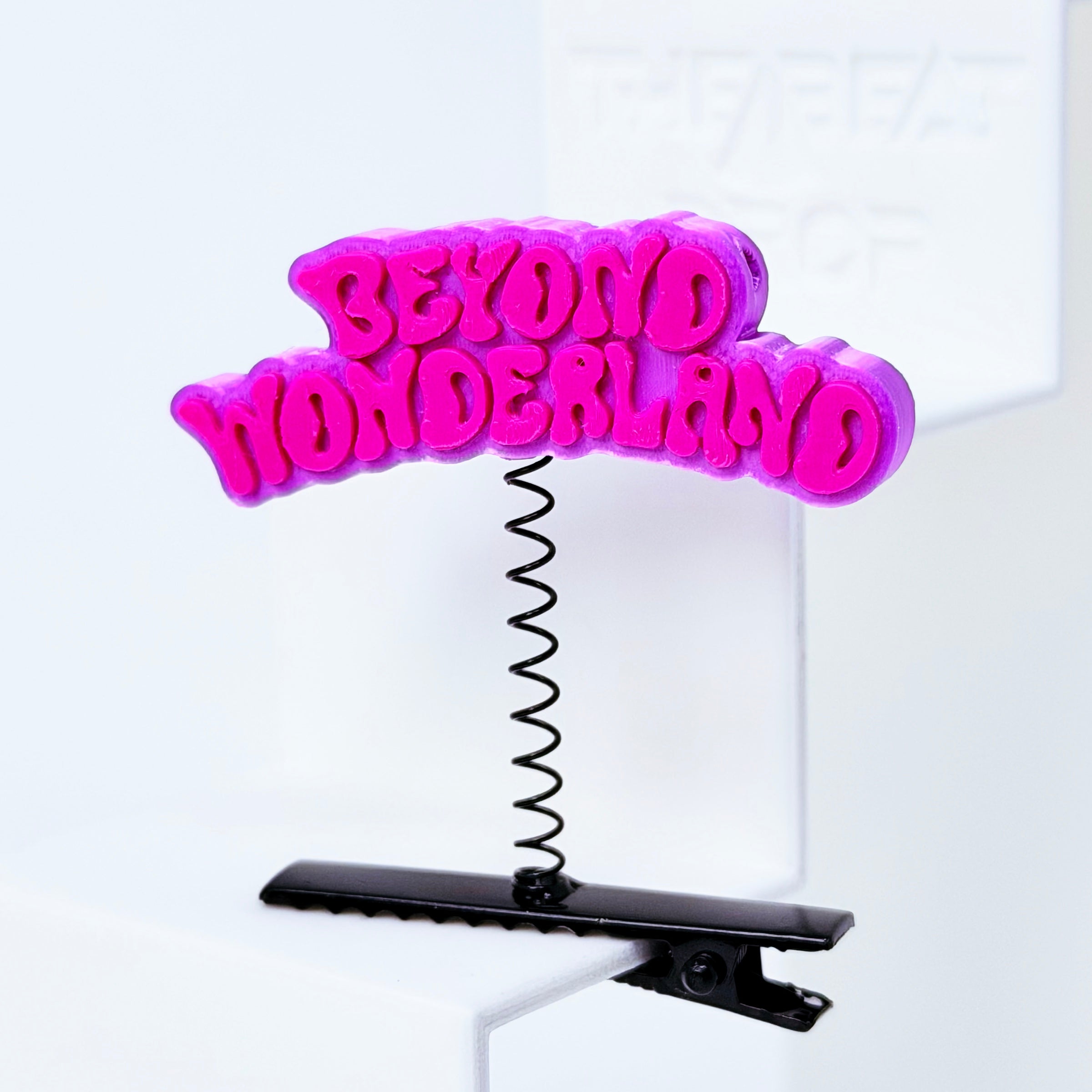 Beyond Wonderland Rave Sprout – Pink & Pink colorway close-up, hot pink magenta text on purple 3D printed charm with black spring clip festival hair clip