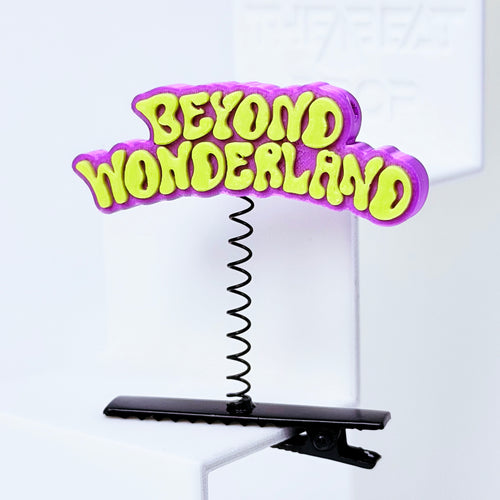 Beyond Wonderland Rave Sprout – Purple & Yellow colorway close-up, neon lime yellow text on purple 3D printed charm black spring clip EDM festival hair clip rave accessory