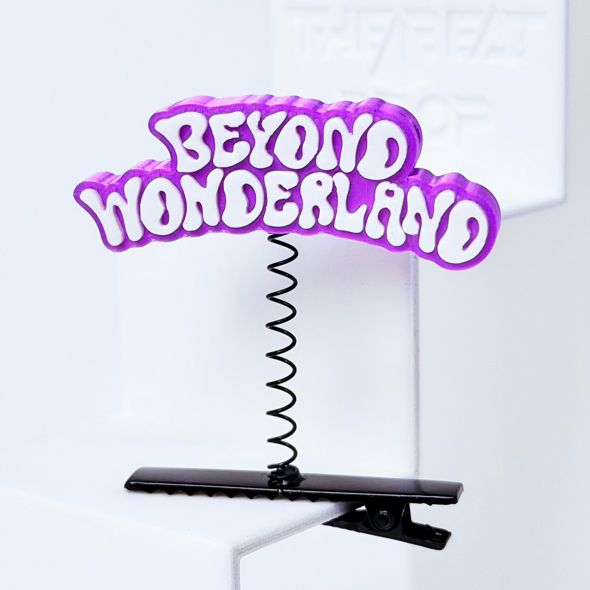 Beyond Wonderland Rave Sprout – Purple & White colorway close-up, white text on purple 3D printed charm black spring clip festival rave hair clip rave trinket