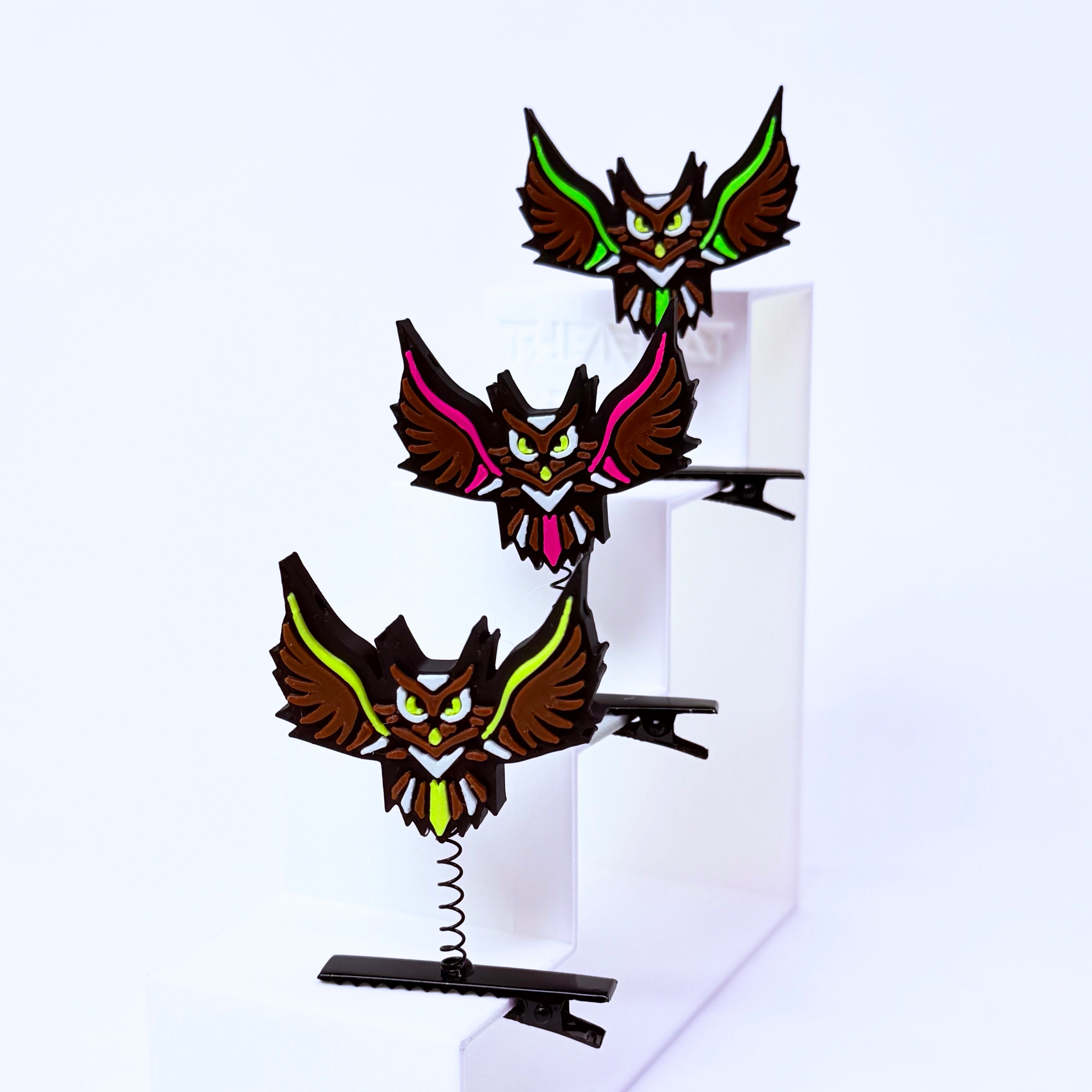 Three Electric Forest owl rave sprouts – 3D printed Sherwood festival hat clips with black metal spring clips and multi-color owl design